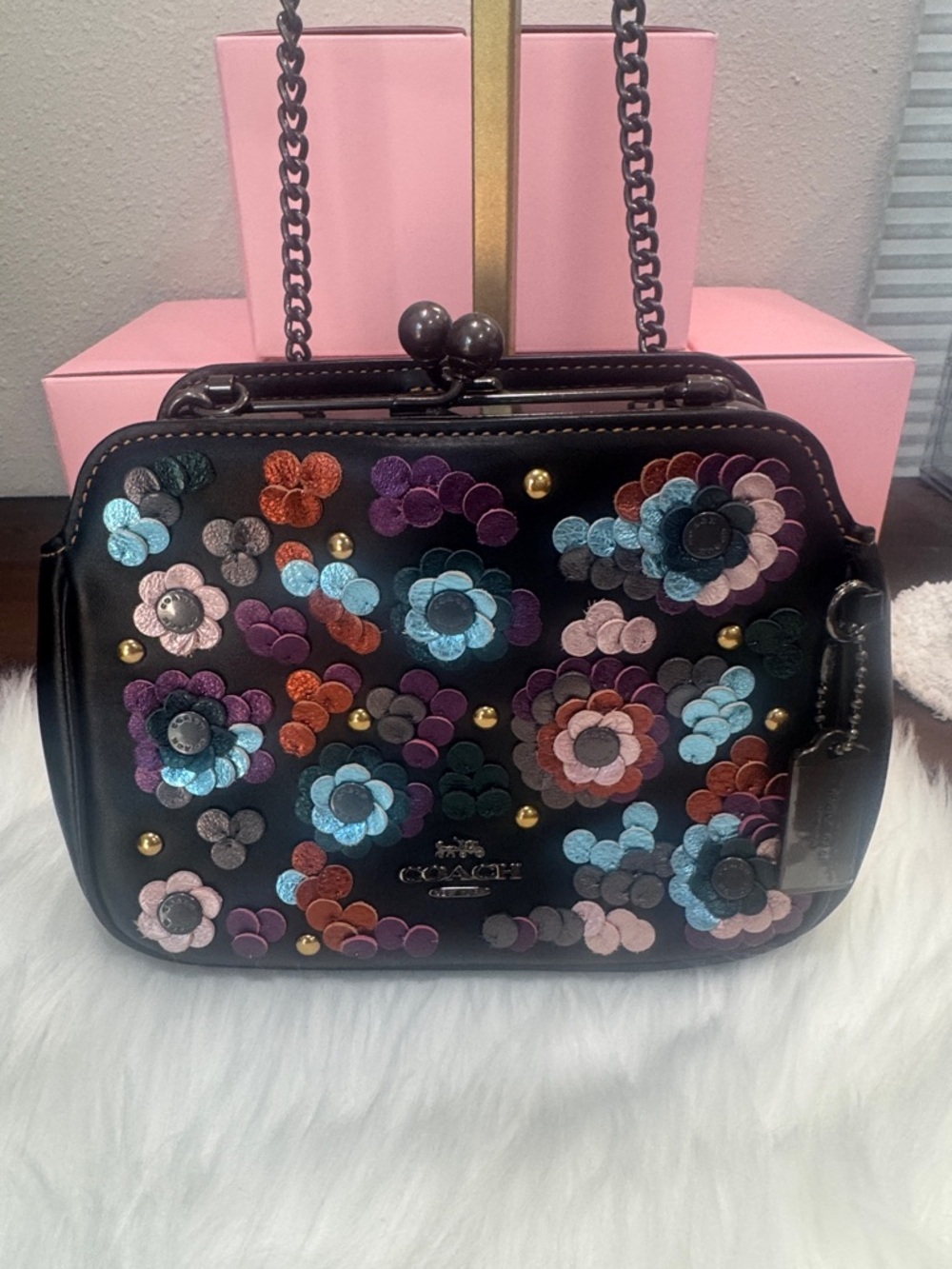 Coach Pearl Kisslock Crossbody
bag with floral leather sequins
